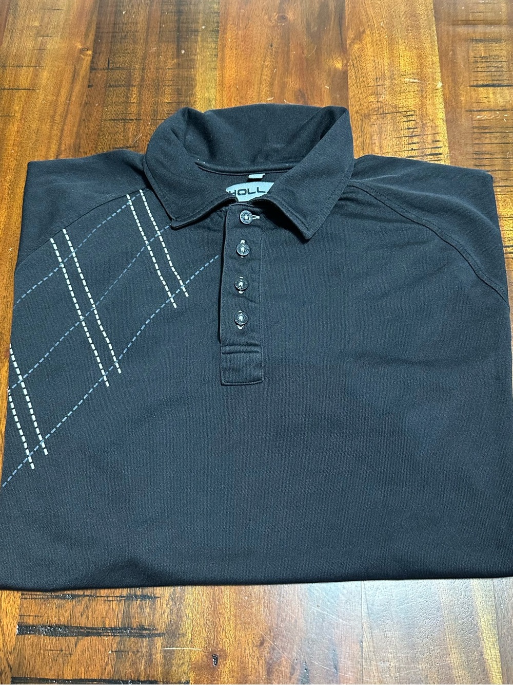 Hollas  Men’s Black Golf Polo with Subtle Argyle Stitching